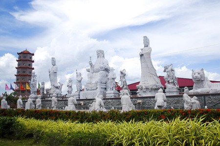 Chinese temple with a row of statue and a pagodaの写真素材