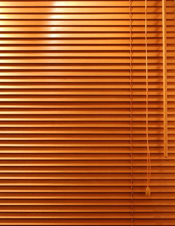 A home interior Venetian blind with wooden slats.