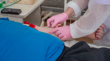 Doctor taking the blood test from a patient