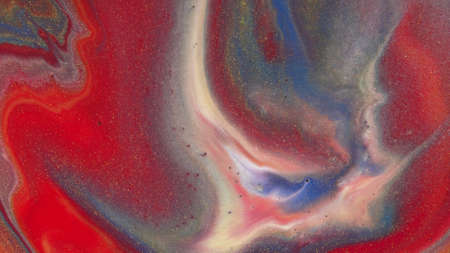 Abstract colorful background of spreading colors. Abstract red paint background.