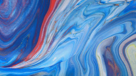 Abstract colorful background of spreading flowers. A unique screensaver picture. Background image. Acrylic paints. Alcohol ink.の写真素材