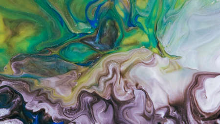 Fluid paint art, marble abstractions in blue, purple, black and yellow.の写真素材