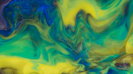 Fluid paint art, marble abstractions in blue, purple, black and yellow.の写真素材
