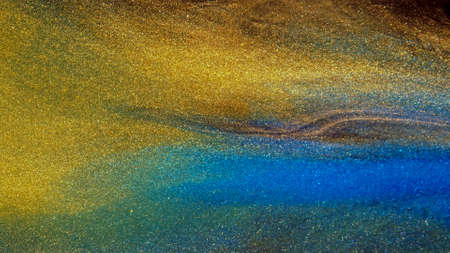 Background of gold dust in a silvery mist with blue, yellow streaks.