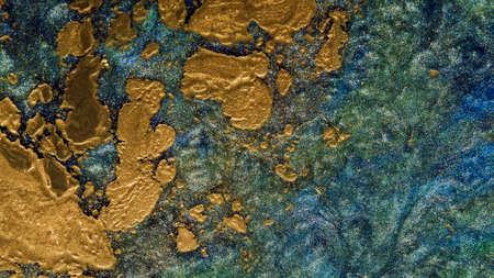 Background of gold dust in a silvery mist with blue, yellow streaks.