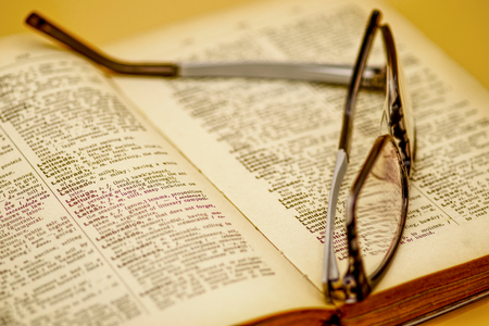 Old dictionary 
and reading glassesの写真素材