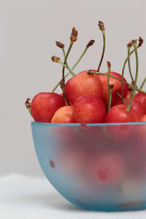 sweet cherry was piled to the bowl of the glass の写真素材