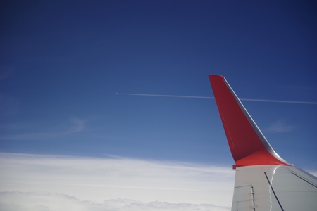 seeing air trail in the airplaneの写真素材