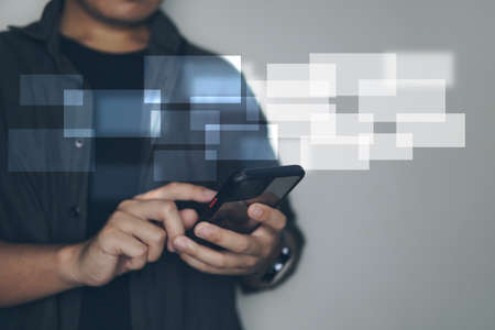 businessman hand using smart phone with digital layer business strategy as concept