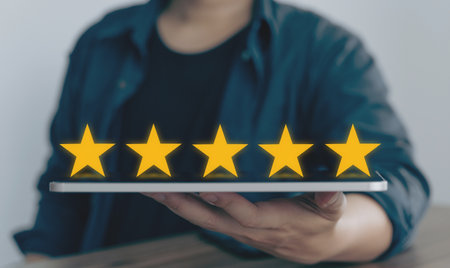 Customer review good rating concept hand pressing five star on visual screen and positive customer...