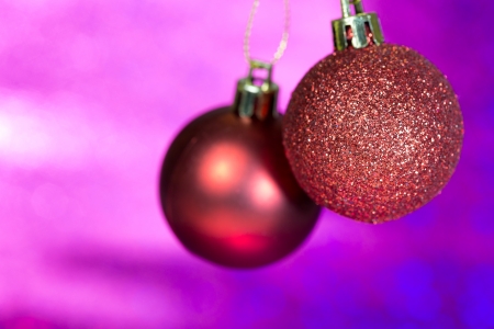 Christmas balls hanging on purpleの写真素材