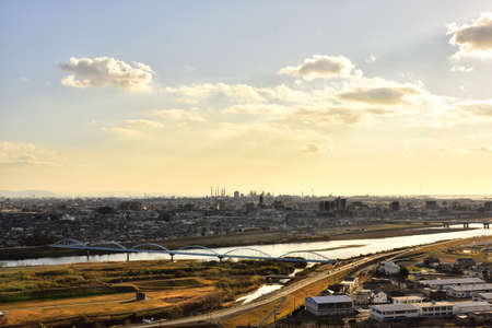 The local plain with river is shined upon by sunset beautifully.の写真素材