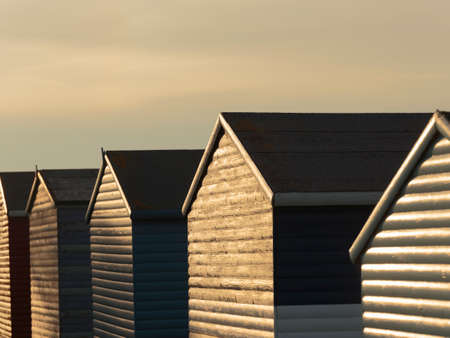 Sunset over beach houses on Tankerton Beach, Whitstable, Englandのeditorial素材