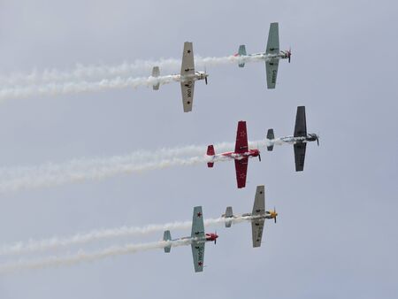 Aerostars aerobatic display team in YAK-50s, Farnborough International Airshow, Farnborough Airport,...