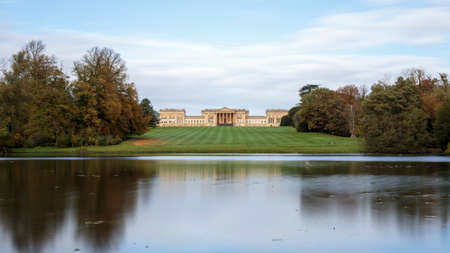 Stowe House from the bank of the Octagon Lake, Stowe National Trust, Buckinghamshire, England, United Kingdomのeditorial素材