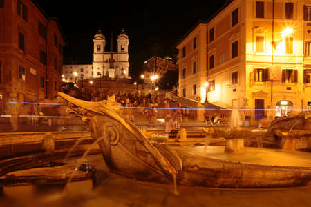 Fontana della Barcaccia (Fountain of the Old Boat) at night near the Spanish Steps (Scalinata della TrinitÃ  dei Monti), Piazza di Spagna, Rome, Italyのeditorial素材