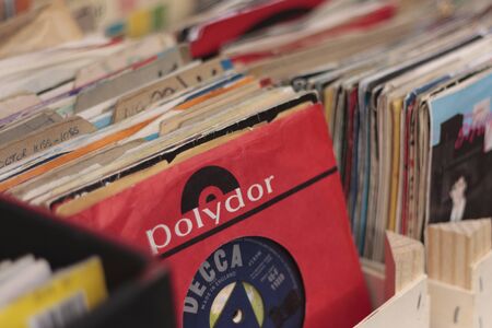 Boxes of 45 rpm vinyl records in Broadway Market, Hackney, London, England, United Kingdomの写真素材