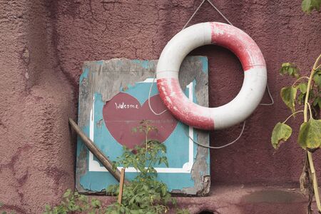 Lifebuoy and Welcome Sign, Regent's Park Canal, London, Englandの写真素材