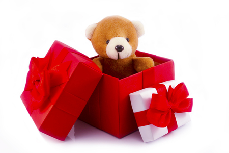 cute teddy bear in red gift box on white background with clipping path,too give someone important in valentine's dayの写真素材