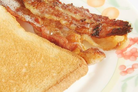 Crispy Streaked Bacon with Toast Bread on white backgroundの写真素材