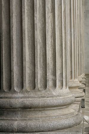 Stone columns from a judicial law building taken during the day