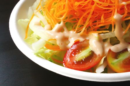 Fresh vegetable salad in a single servingの写真素材