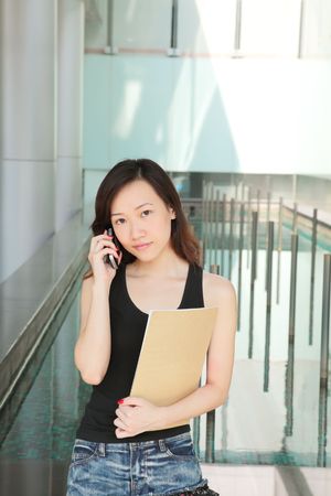 Asian Young Career Woman Outside an Officeの写真素材