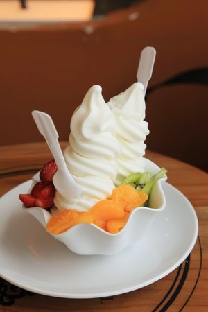 Soft Ice Cream Swirls with Colorful Mixed Fruitsの写真素材