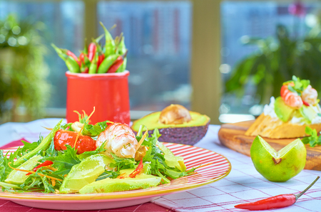 Fresh salad with arugula, shrimp and poached eggの写真素材