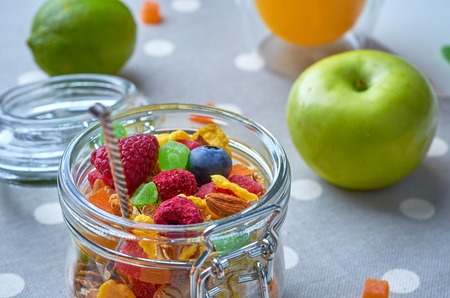 Healthy breakfast with muesli, milk, yogurt various fruits