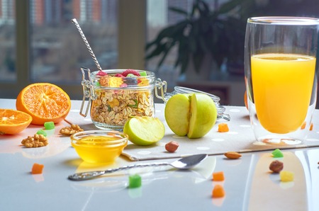 Healthy breakfast with muesli, milk, yogurt various fruitsの写真素材