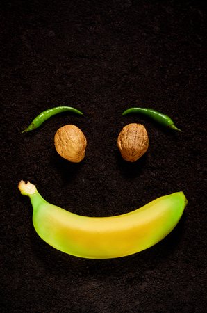 the emotion of joy with the use of organic products of banana, nuts and pepperの写真素材