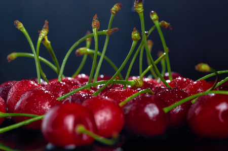 cherries on a black backgroundの写真素材