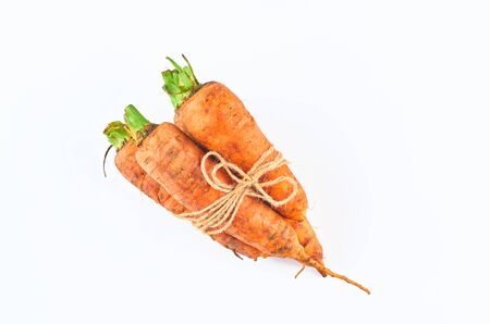 Three carrot isolated on white background. The view from the top. Organic food background.の写真素材