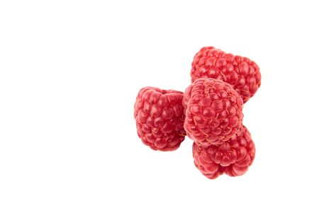 Four red raspberry Berries isolated on white background. The view from the top.