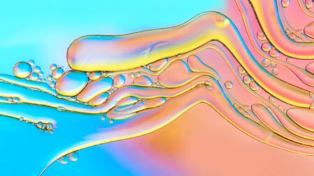 Colorful abstract images of oil drops on water. Colored circles and waves as a concept of scientific discovery, space or molecular research.の写真素材