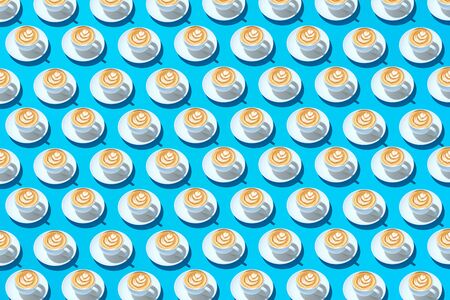 Mugs with coffee on a saucer and foam in the form of a flower on a light blue background. Abstract...