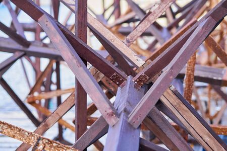Chaotic wooden planks and metal structures. Abstract background.