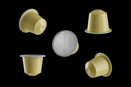 Yellow espresso coffee capsules on a black background, close-up from different sidesの写真素材