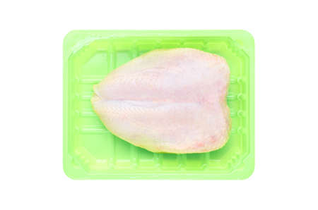 Fresh chicken breast in green plastic packaging, isolated on a white background. The view from the top.の写真素材