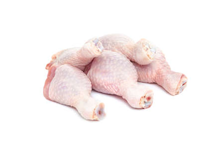 Set of five fresh raw chicken drumsticks on a white background. Close up.の写真素材