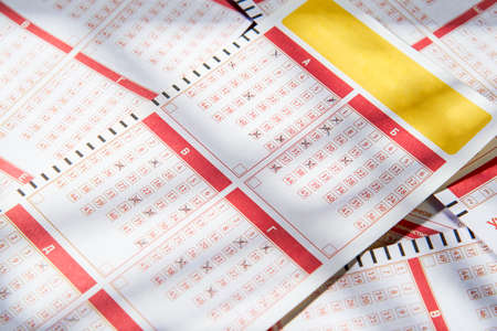 Filled lottery tickets close up, playing lottery or bingo has a chance to win the jackpot. Free space for text.の写真素材