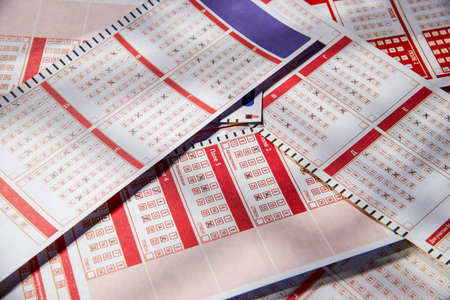 Filled lottery tickets close up, playing lottery or bingo has a chance to win the jackpot. Free space for text.の写真素材