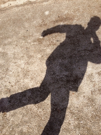 Shadow of a posing person