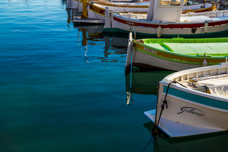 Mediterranean style owing boats in a glassy harbourのeditorial素材