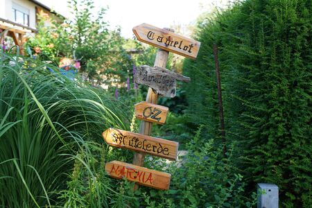 Signs with the names of fantasy forests, - Camelot, nowhere land, oz, Sherwood, Narnia, Middle-earthの写真素材