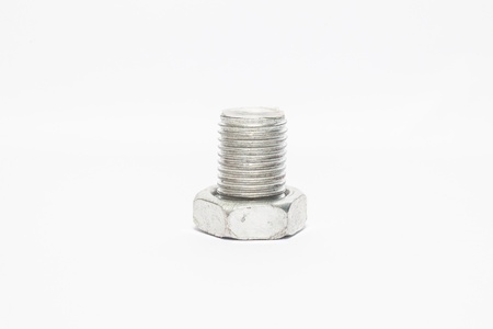 Used and new nuts for manufacturing and industry with white backgroundの写真素材