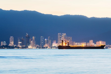 George Town City high rise building view with mountain and sea, Penang Malaysiaの写真素材