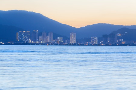 George Town City high rise building view with mountain and sea, Penang Malaysiaの写真素材