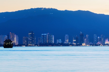 George Town City high rise building view with mountain and sea, Penang Malaysiaの写真素材